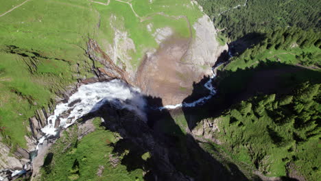 Aerial-Flyover-Revealing-the-Majestic-Engstligen-Waterfall,-Switzerland