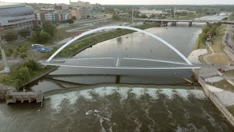 Iowa-Women-of-Achievement-Bridge-over-Des-Moines-River-in-Des-Moines,-Iowa-with-drone-video-moving-down-and-tilting-up