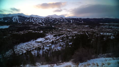 Stunning-pan-to-the-left-Boreas-Pass-Breckenridge-ski-town-ten-mile-peak-Colorado-ski-trails-during-sunset-mid-epic-pass-orange-yellow-bright-clouds-shaded-landscape-family-vacation-Rocky-Mountains