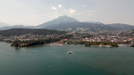 Aerial-Panorama-of-Lake-Lucerne-with-Lakeside-Town-in-Distance,-Switzerland