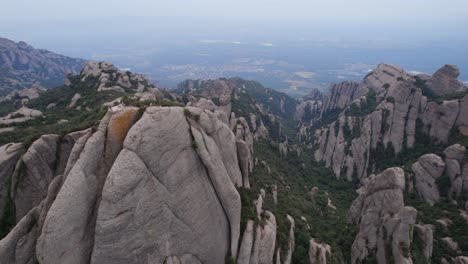 Aerial-surrounding-shot-of-the-viewpoint-in-the-mountains-close-to-the-Monestary-of-Montserrat-in-Spain,-Europe