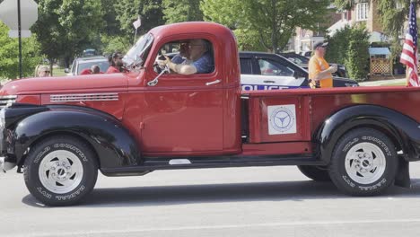 Old-red-pick-up-truck-at-a-parade