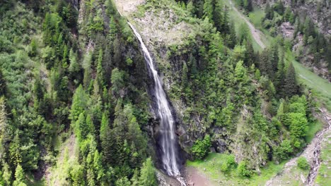 Reveal-of-waterfall-and-mountain-near-Wager-Alm-Mittersill-in-Austria