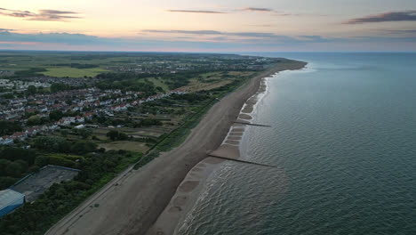 Sunset-over-Skegness,-a-town-with-a-stunning-coastline-and-plenty-of-things-to-see-and-do,-as-seen-from-above