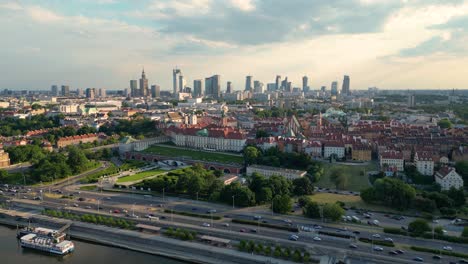 Aerial-panorama-of-Warsaw,-Poland-over-the-Vistual-river-and-City-center-in-a-distance-Old-town