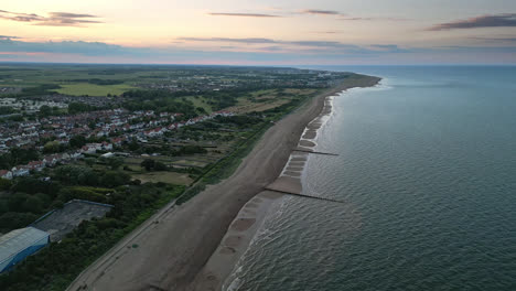 Sunset-over-Skegness,-a-town-with-a-long-history-and-a-bright-future,-as-seen-from-a-drone