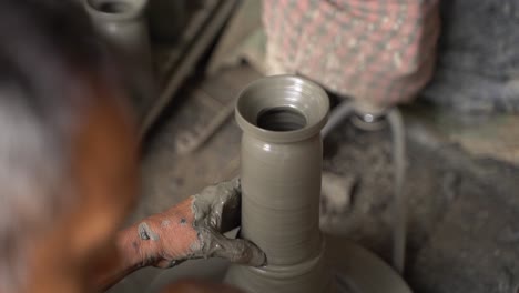 A-potter-is-making-clay-objects-with-a-pot