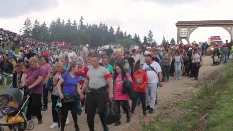 Pilgrims-at-Csiksomlyo-Pilgrimage-clear-dirt-road-for-SMURD-ambulance