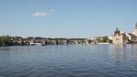 Charles-bridge-over-Vltava-river-in-Prague,-Panning-left