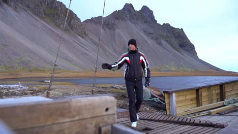 Young-Caucasiang-Man-Prepares-to-Go-Fishing-at-Iceland-Vestrahorn-Mountains