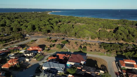 High-drone-flight-over-Perth-City-residential-area-overlooking-the-ocean