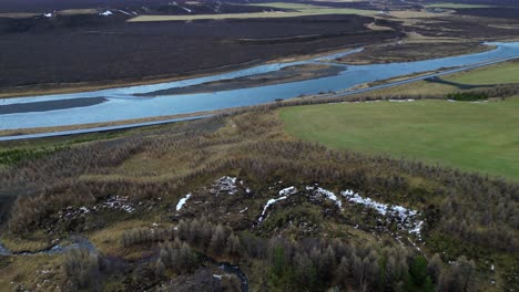 Aerial-Drone-Fly-Above-Kirkjufellfoss-Iceland-Natural-Panoramic-Landscape-Green-Water-Hills-and-Skyline,-Establishing-Shot
