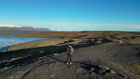 Young-Man-Enjoys-Iceland-Sólheimajökull-Landscape-Volcanic-Glacier-Aerial-Drone-Panoramic-View