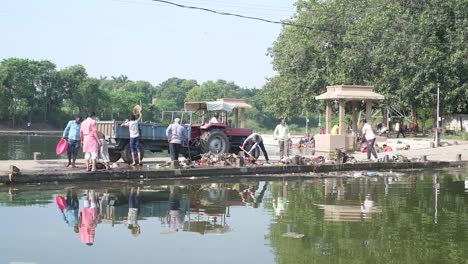 Many-NGO-workers-are-removing-the-plastic-waste-and-plastic-waste-from-the-river-with-the-help-of-hands-and-cleaning-the-river