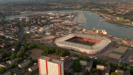 Close-up-slider-aerial-shot-of-Southampton-FC-stadium-and-river-Itchen