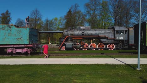Drone's-Eye-Journey:-Captivating-Haapsalu,-Estonia---Museum-Trains-and-Panoramic-Cityscape---4K