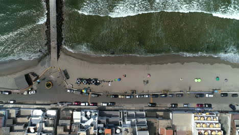 Aerial-view-above-the-a-beach-on-a-coast-of-San-Bartolo,-in-Peru---top-down,-drone-shot
