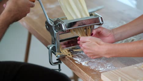 Unrecognizable-Couple-Making-Tagliatelle---Slow-Motion---Homemade-Pasta-Delight:-Close-Up