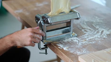 Slow-Motion-Pasta-Mastery:-Couple's-Artistry-with-Traditional-Pasta-Machine---Close-Up-4K-Shot