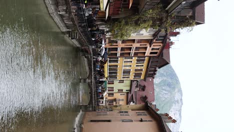 Touristic-Canal-River-in-City-of-Old-Town,-Annecy---Vertical-Footage