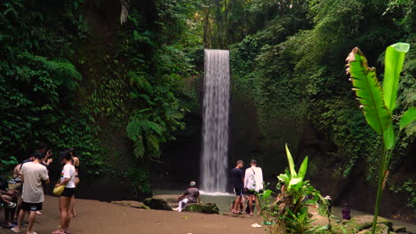 Tourists-Enjoying-the-Scenic-Tibumana-Waterfall-in-Bali