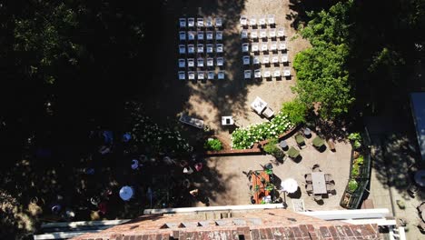 Top-down-aerial-of-a-stunning-wedding-party-in-preparation-on-a-beautiful-summer-day
