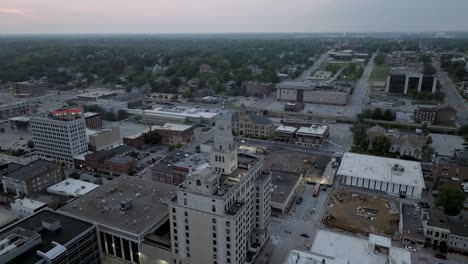 Downtown-Davenport,-Iowa-with-drone-video-moving-in-a-circle-at-dusk