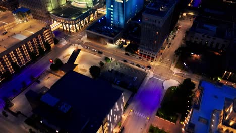 Downtown-Des-Moines,-Iowa-buildings-at-sunset-with-drone-video-tilting-up-and-moving-in-close-up