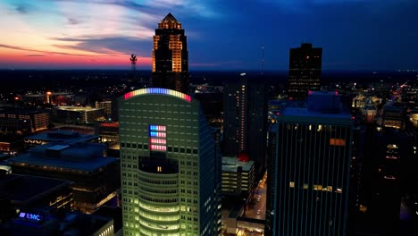 Downtown-Des-Moines,-Iowa-buildings-at-sunset-with-drone-video-moving-right-to-left-close-up
