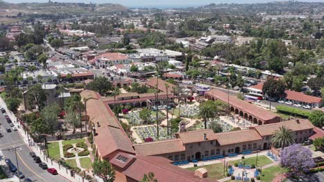 Aerial-wide-rising-and-panning-shot-of-the-Mission-San-Juan-Capistrano-in-California
