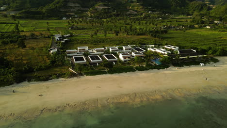 Luxury-waterfront-Amber-Lombok-Beach-Resort-at-Torok-beach-Indonesia,-aerial-view