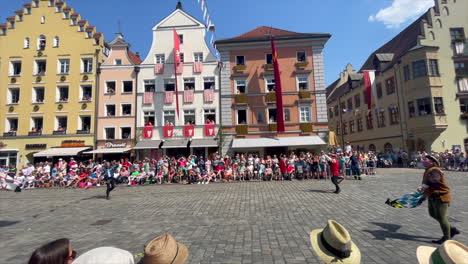Flag-bearers-throwing-flags-at-the-Parade-at-the-Landshut-wedding,-a-historical-celebration-of-1475-that-is-reenacted-every-4-years,-Landshut,-Germany