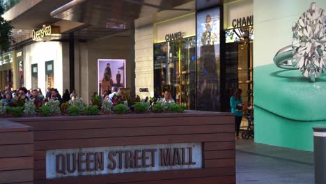 Static-shot-capturing-large-crowds-of-people-in-bustling-downtown-Brisbane-city,-strolling-and-shopping-at-iconic-Queen-street-mall,-outdoor-pedestrian-shopping-mall-on-a-sunny-day