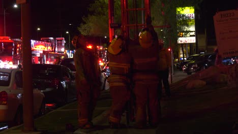 firefighters-take-ladder-away-from-scene