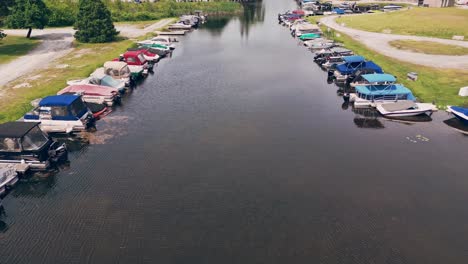 Boats-And-Yachts-Parked-In-Lake-Marina---aerial-drone-shot
