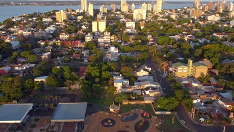 Aerial-drone-footage-of-a-park-playground-in-the-middle-of-a-large-city-in-Posadas,-Misiones,-Argentina