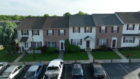 Drone-captures-harmonious-neighborhood-houses-with-kid-dancing-joyfully