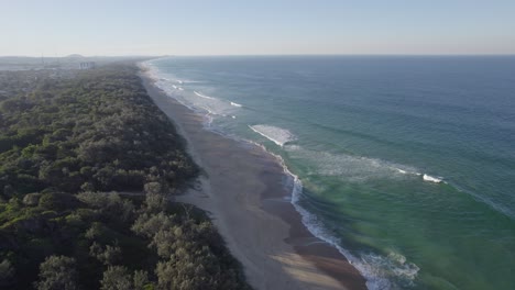 Wurtulla-Beach-With-Scenic-Seascape-And-Lush-Vegetation-In-Queensland,-Australia---aerial-drone-shot
