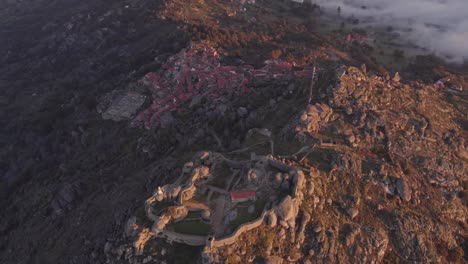Panorama-shot-of-medieval-mountain-village-Monsanto-with-granite-houses-in-the-morning,-aerial