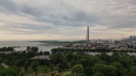 Aerial-Panoramic-View-Of-Industrial-Plant-With-Towers-On-A-Cloudy-Day