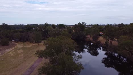 Dolly-aerial-shot-of-Swan-River-in-Viveash-Australia-as-daylight-falls