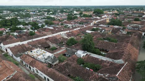 Aerial-above-Santa-Cruz-de-mompox-colonial-town-village-with-traditional-old-architecture-buildings-in-Colombia-Bolivar-department-drone-fly-above-city-center-historical