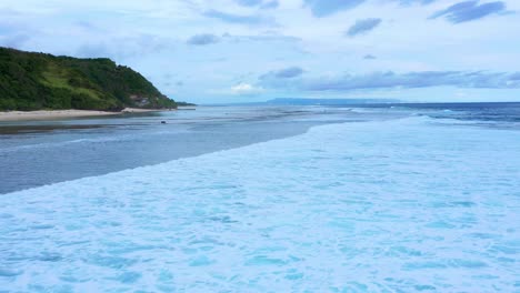 Foamy-Sea-Waves-Of-Gunung-Payung-Beach-In-Bali,-Indonesia---aerial-drone-shot
