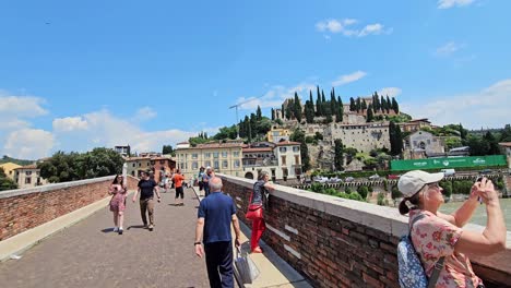 Gimbal-video-of-strolling-at-arch-bridge-Ponte-Pietra-Verona-tourism-Italy