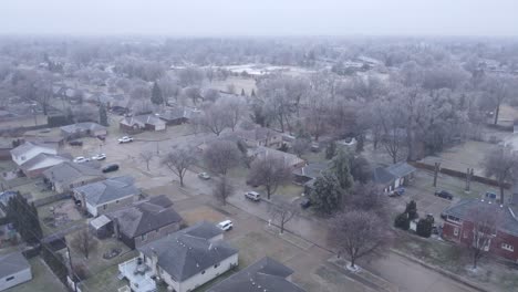 Ice-storm-covered-small-USA-town,-aerial-drone-view