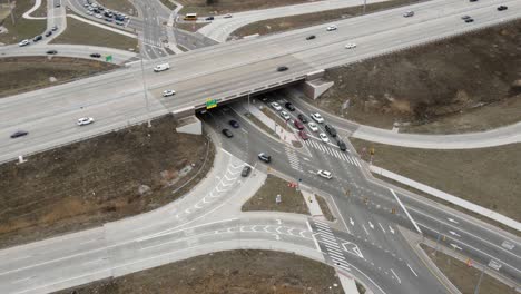 Modern-diamond-shape-highway-intersection,-aerial-time-lapse-view