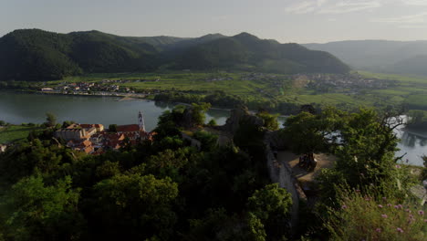 panoramic-movement-overview-shot,-Danube-river-valley,-green-mountains-in-Austria,-Europe