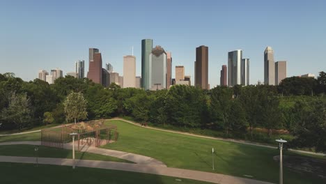 Aerial-drone-view-of-Buffalo-Bayou-Park-revealing-downtown-Houston-skyline-in-Houston-Texas