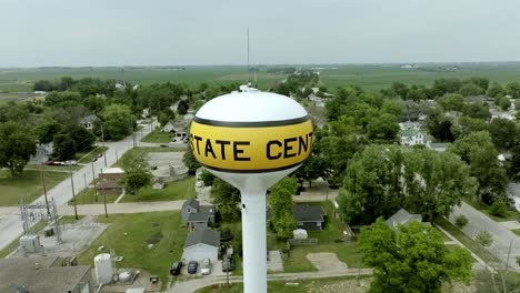 Water-tower-in-State-Center,-Iowa-with-drone-video-moving-in-a-circle