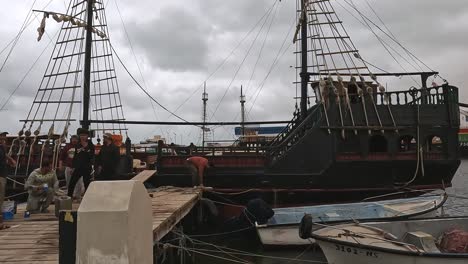 Second-part-of-Djerba-harbor-with-touristic-pirate-galleon-boats-on-cloudy-day-in-Tunisia-footage